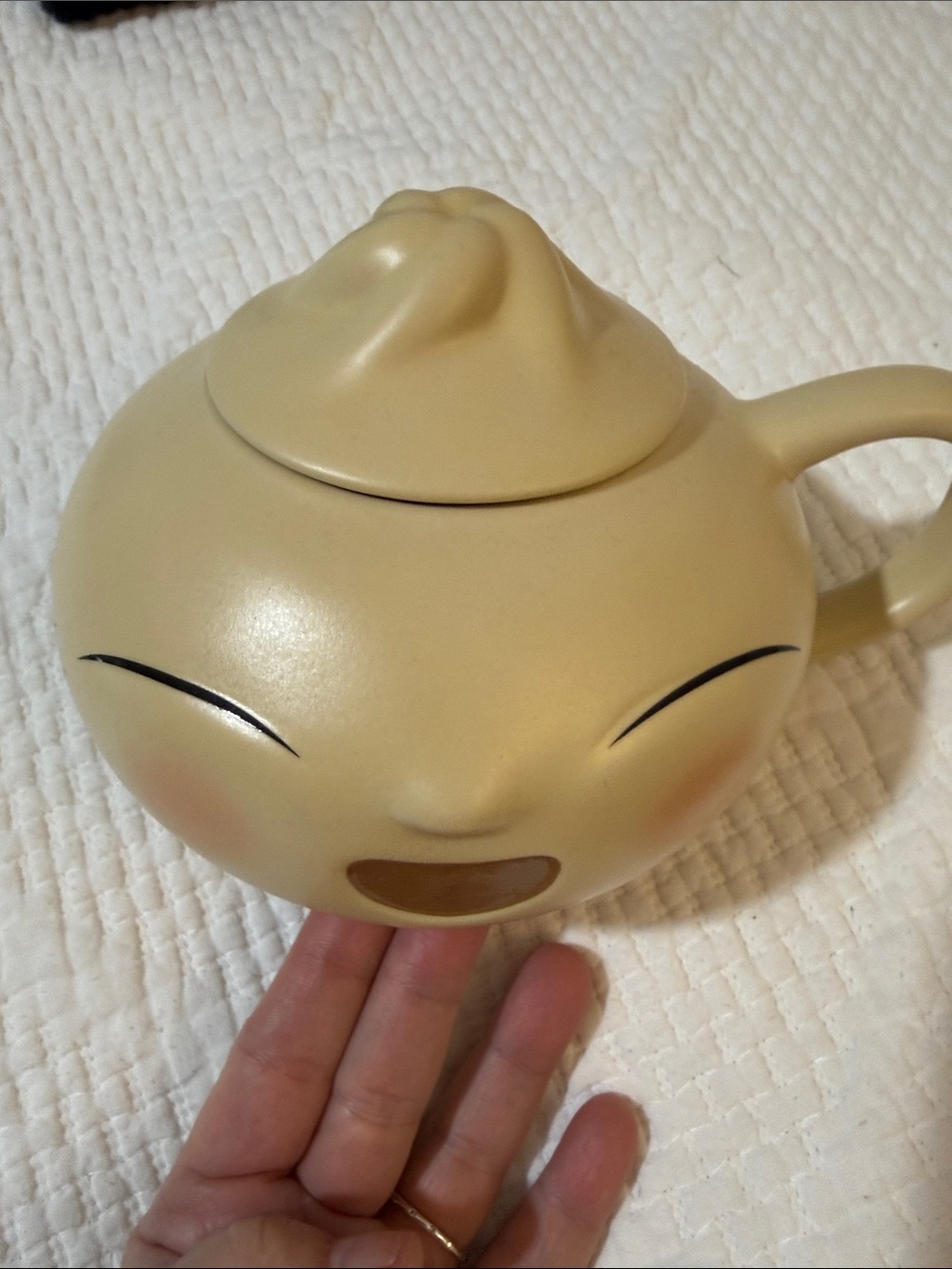 Disney Store Pixar Bao Figural Mug with Lid crafted from cream ceramic